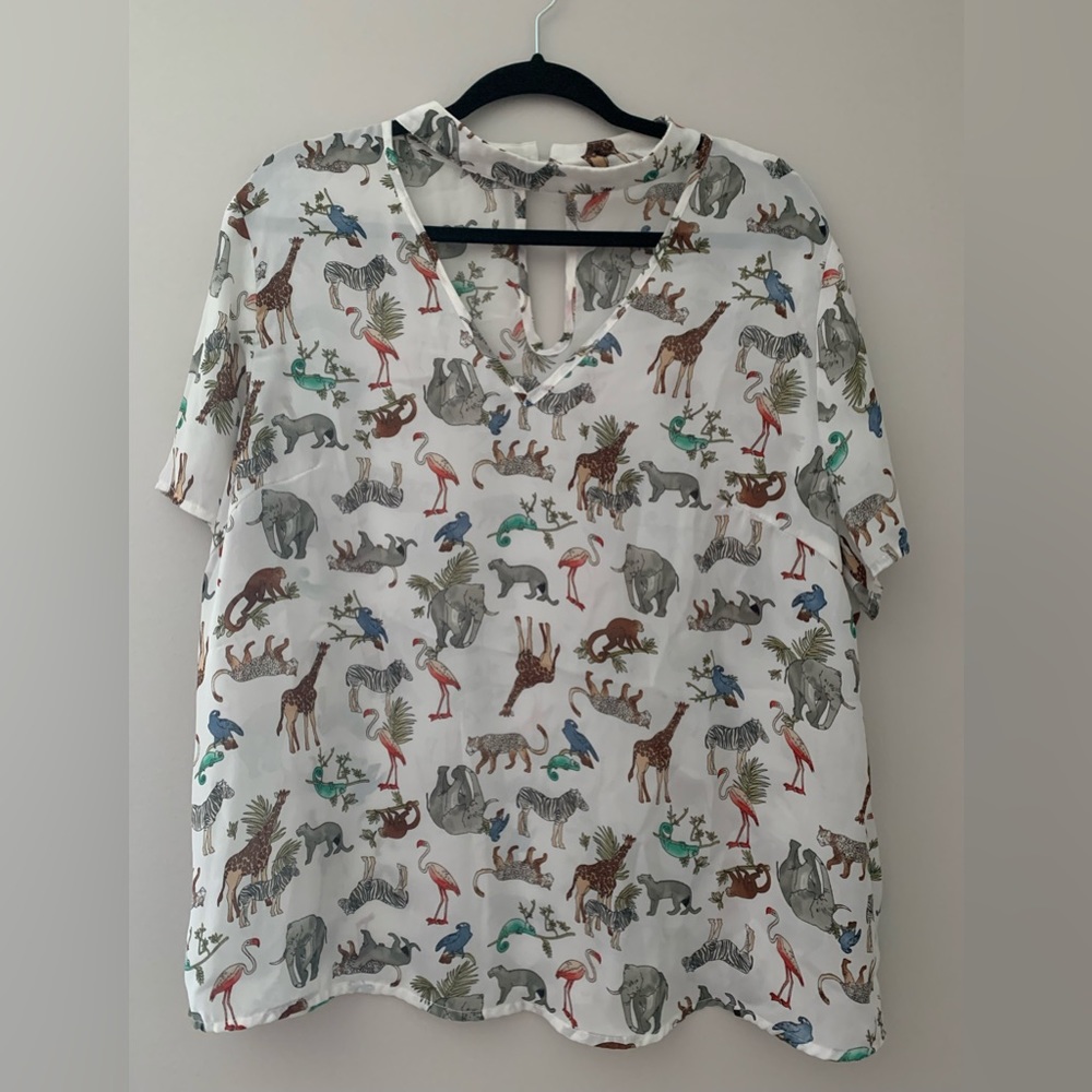 Jungle animal print blouse. Unique neckline.
